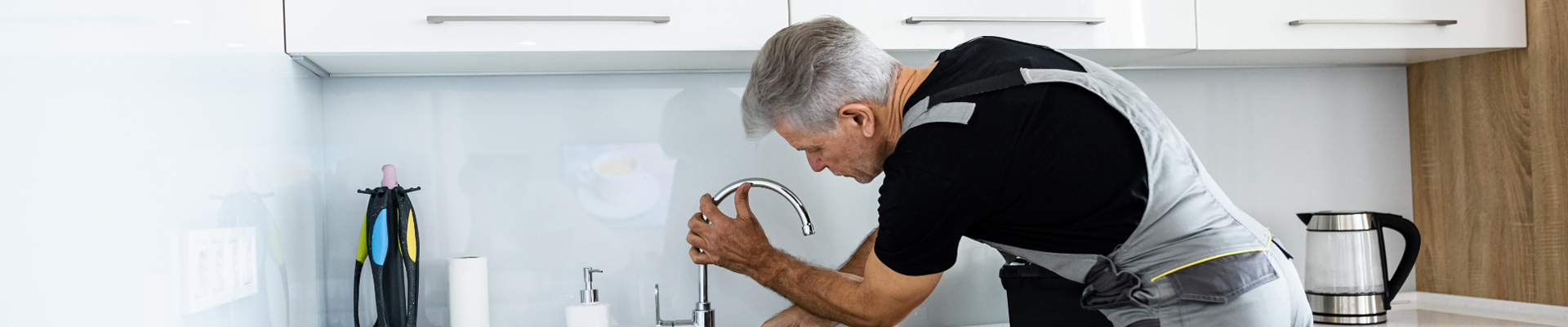 Plumber repairing a tap